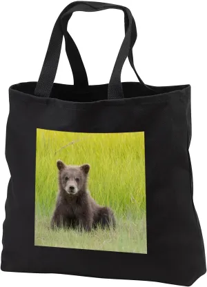 Black Tote Bag 14w x 14h x 3d - Alaska. Grizzly bear cub sits in a meadow in Lake Clark NP. Bears